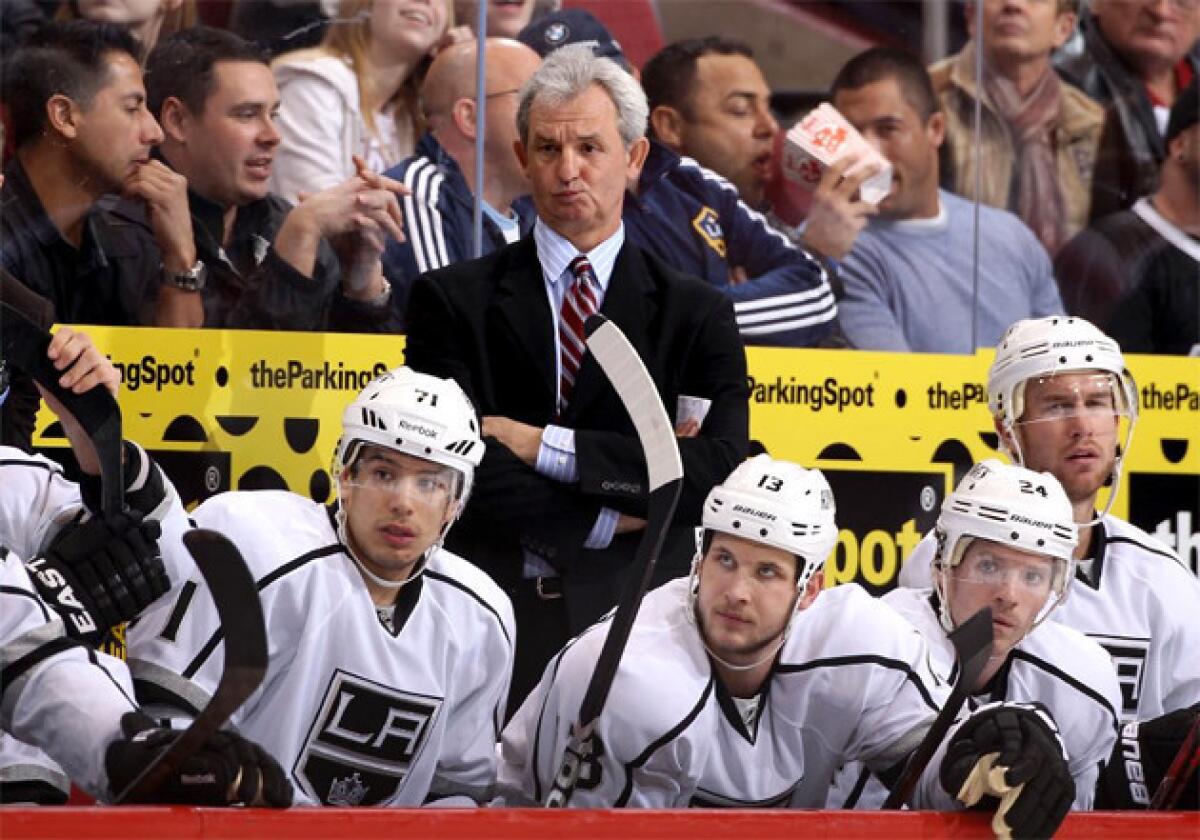Kings Coach Darryl Sutter watches from the bench during a game against the Phoenix Coyotes.