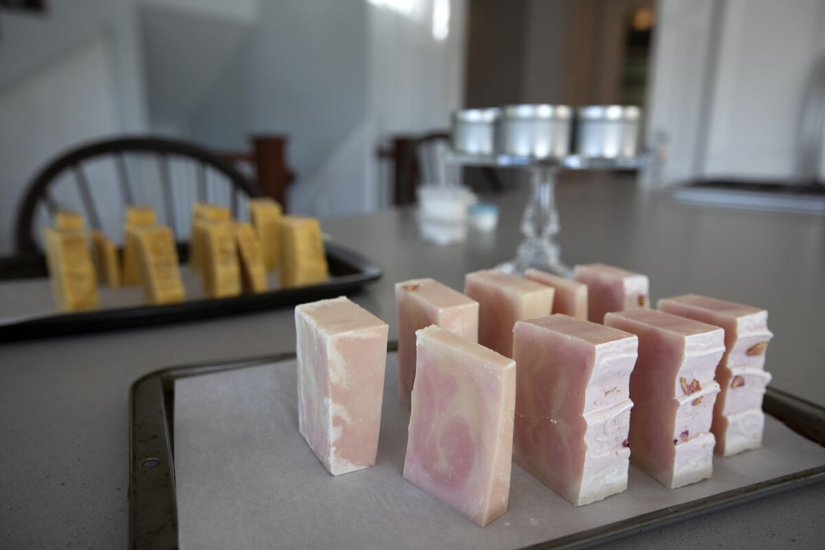 Handmade soap sits on a table.