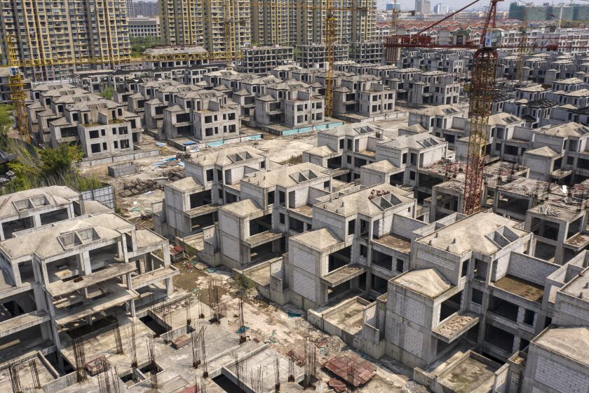 Residential buildings under construction at Tahoe Group Co.'s Cathay Courtyard development in Shanghai, China, on Wednesday, July 27, 2022. The year-long slump in the property market is likely to be a focus for the Politburo, the country's top decision-making body, with the recent spate of people not paying their mortgages threatening to drag sales down even further and damage banks and builders. Photographer: Qilai Shen/Bloomberg via Getty Images