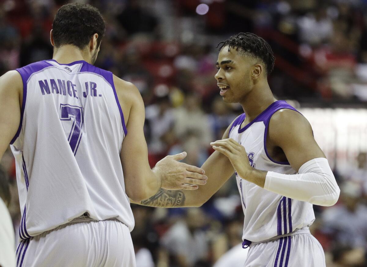 Lakers guard D'Angelo Russell, right, celebrates with teammate Larry Nance Jr. after a play against the Cavaliers during the first half of a summer league game on July 14.