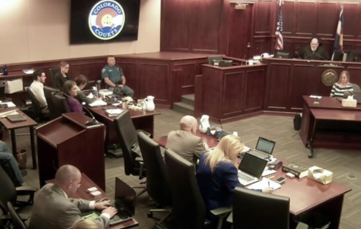 Colorado theater shooter James Holmes, top left in light-colored shirt, sits in Arapahoe County District Court, where his trial continues Thursday in Centennial, Colo.