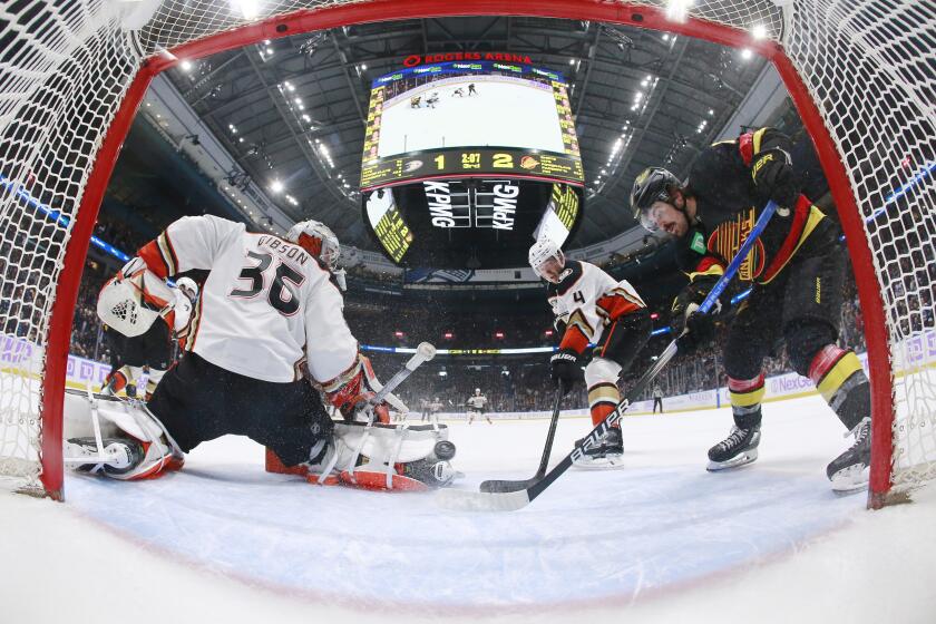 VANCOUVER, CANADA - NOVEMBER 28: Cam Fowler #4 looks on as John Gibson.