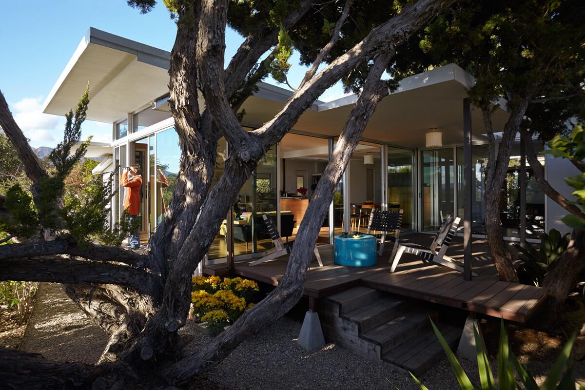 Amy Shock, left, relaxes with some bird-watching off of the back porch of her mobile home in Ojai. (Gaszton Gal)