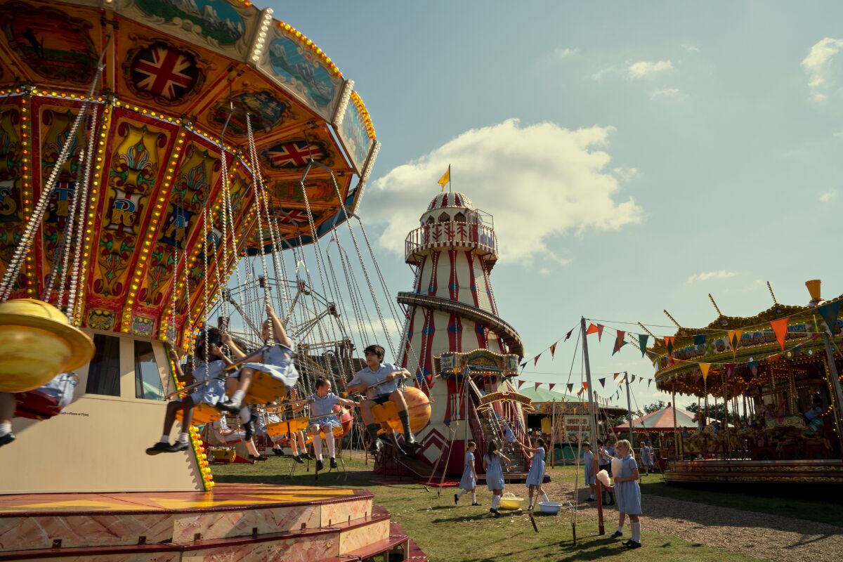 Children on carnival rides.