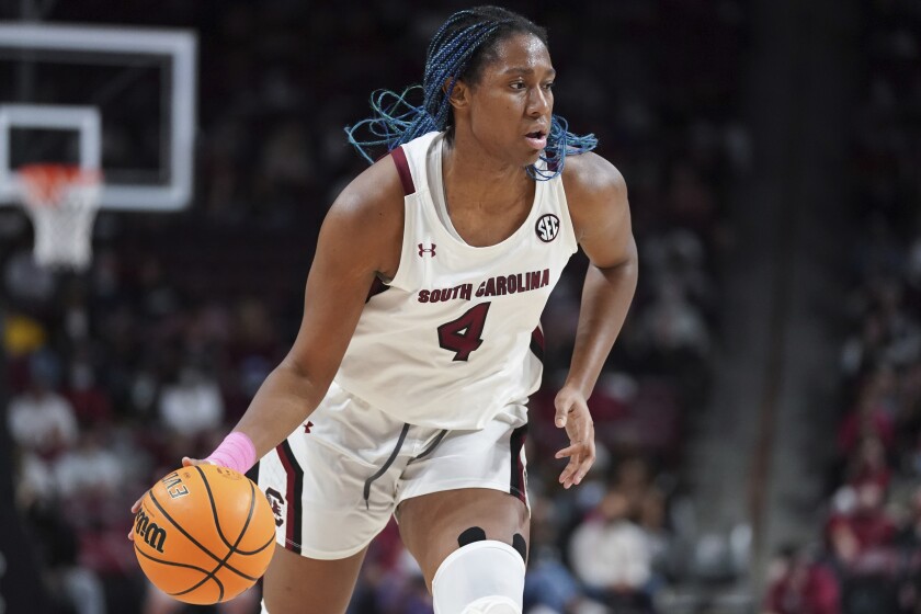 FILE - South Carolina forward Aliyah Boston dribbles during the first half of an NCAA college basketball game against Auburn, Feb. 17, 2022, in Columbia, S.C. Boston was named the Collegiate Woman Athlete of the Year on Monday, June 27, 2022. (AP Photo/Sean Rayford, File)