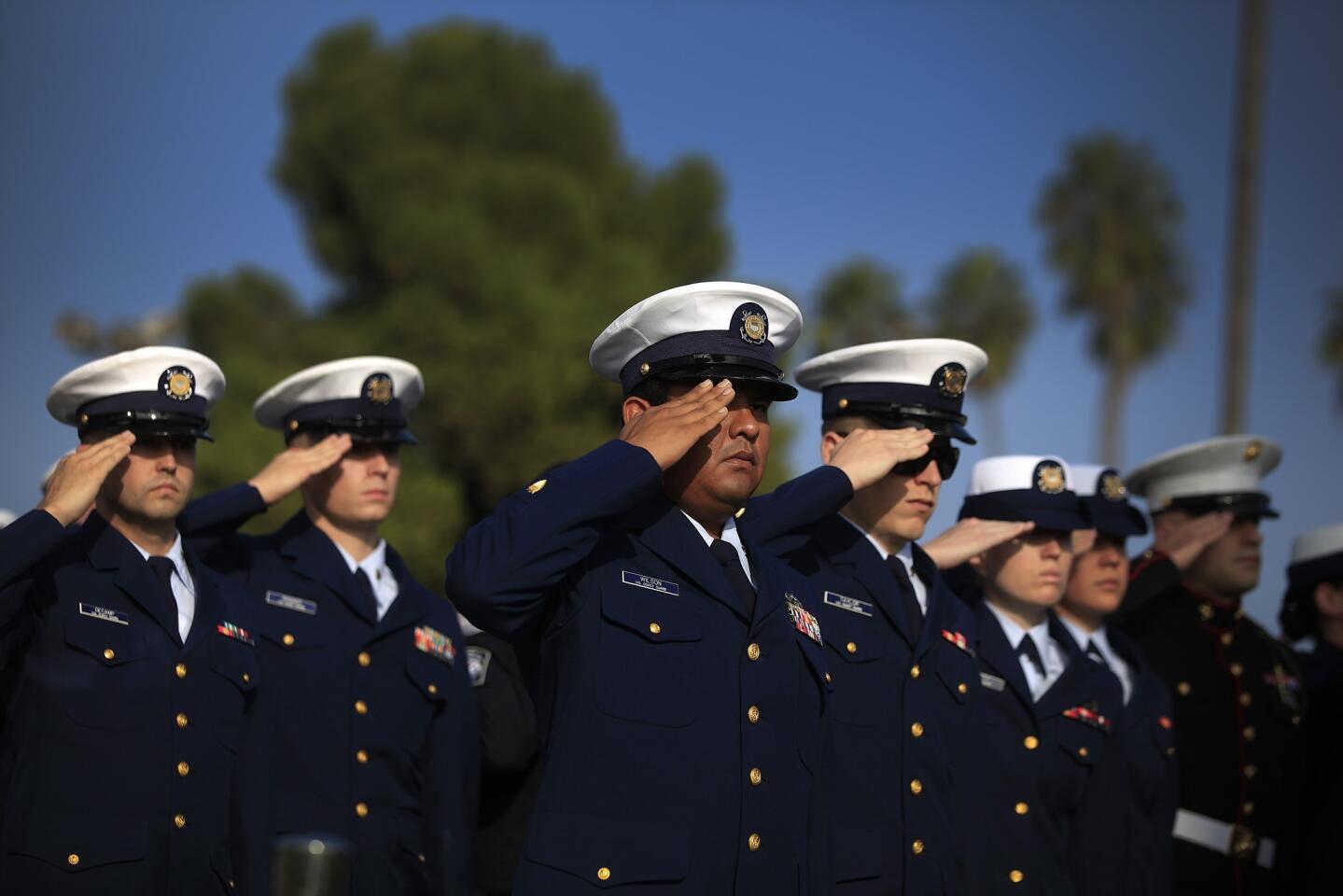 Coast Guard members salute