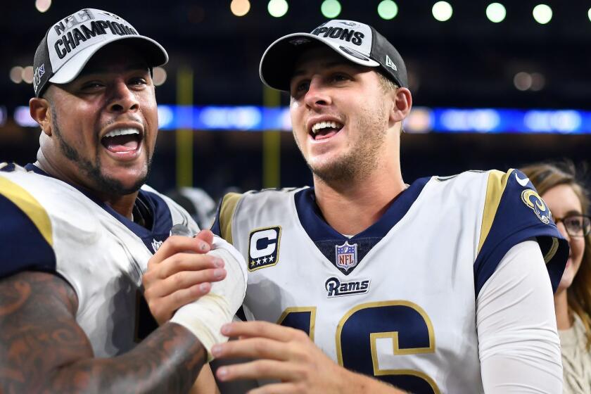 DETROIT, MICHIGAN DECEMBER 2, 2018-Rams gurd Rodger Saffold, left, and qaurterback Jared Goff celebrate after defeating the Lions at Ford Field in Detroit Sunday. (Wally Skalij/Los Angeles Times)