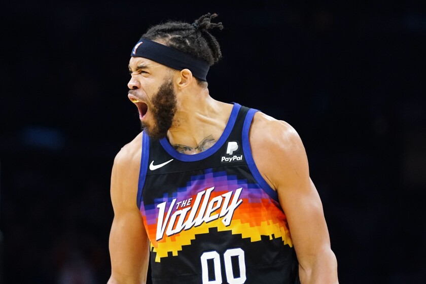 Phoenix Suns center JaVale McGee shouts after a Suns defensive stop against the Detroit Pistons during the first half of an NBA basketball game Thursday, Dec. 2, 2021, in Phoenix. (AP Photo/Ross D. Franklin)