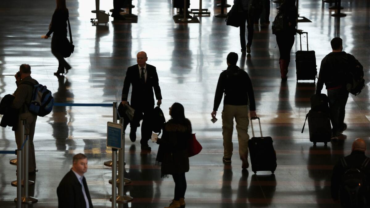 Travelers at Ronald Reagan Washington National Airport. A survey of business travelers found that they feel safest visiting Washington, D.C., and Los Angeles.