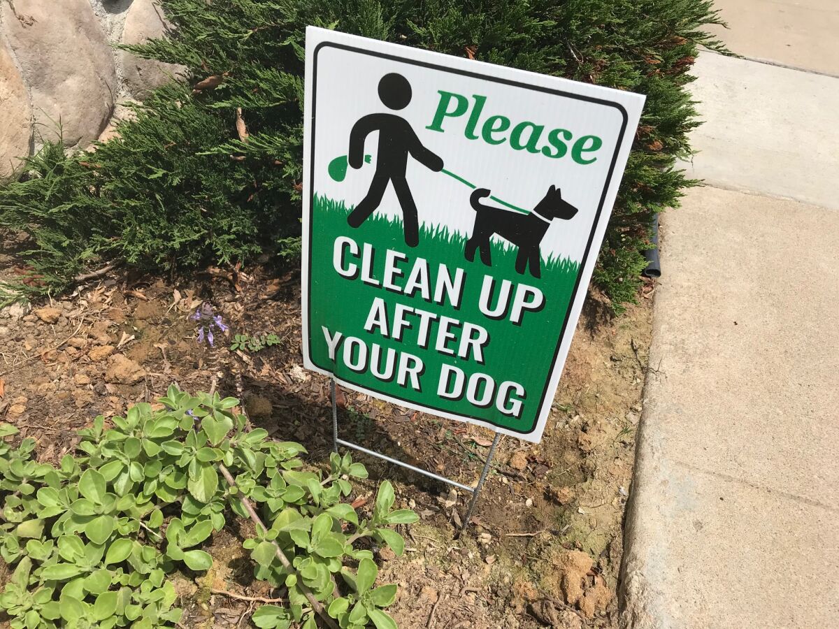 It seems to Inga that signs like this only encourage some dog owners to do the opposite.