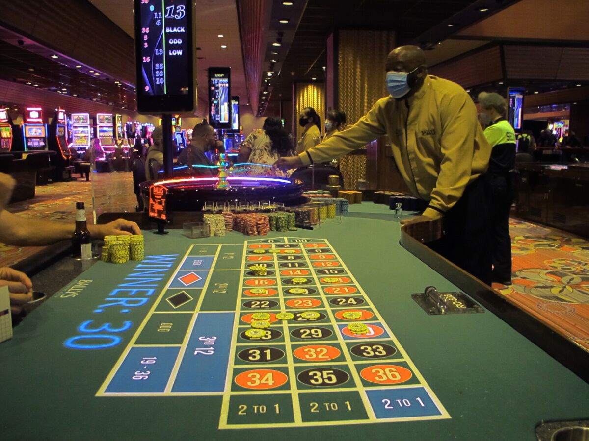 A dealer conducts a game of roulette in Bally's casino in Atlantic City, N.J. on June 23, 2021. On Thursday, Dec. 9, 2021, the American Gaming Association released statistics showing America's casinos have won more this year than ever before at $44.15 billion, and with more than a month still remaining in the year. (AP Photo/Wayne Parry)