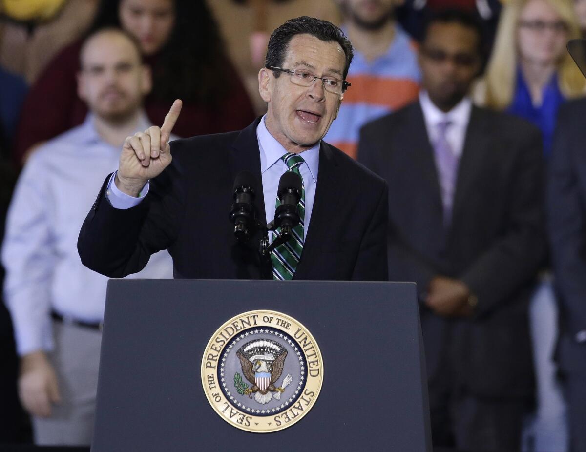 Connecticut Gov. Dannel P. Malloy introduces President Obama before the president's speech on the minimum wage during an event at Central Connecticut State University in New Britain.