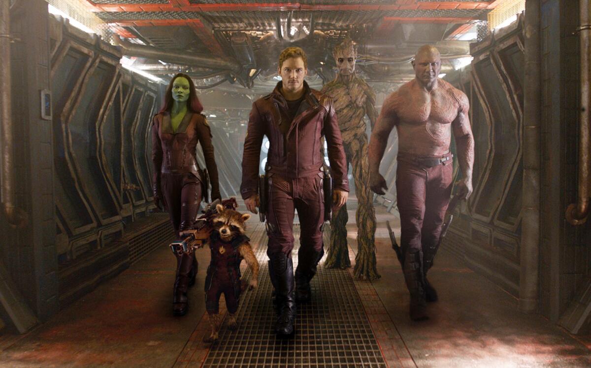 From left, Zoe Saldana; the character Rocket Raccoon, voiced by Bradley Cooper; Chris Pratt; the character Groot, voiced by Vin Diesel, and Dave Bautista in a scene from "Guardians Of the Galaxy."