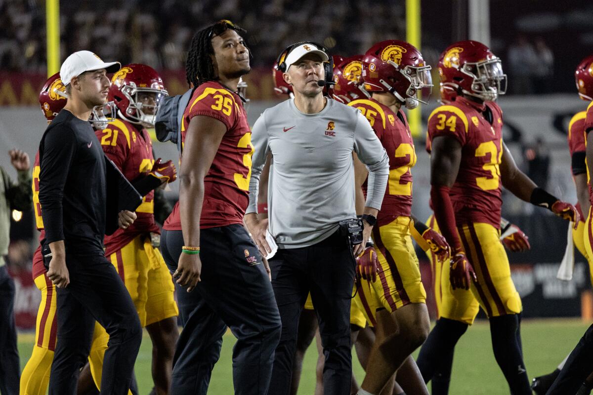 USC coach Lincoln Riley watches a replay during the team's 52-42 loss to Washington at the Coliseum on Nov. 4.