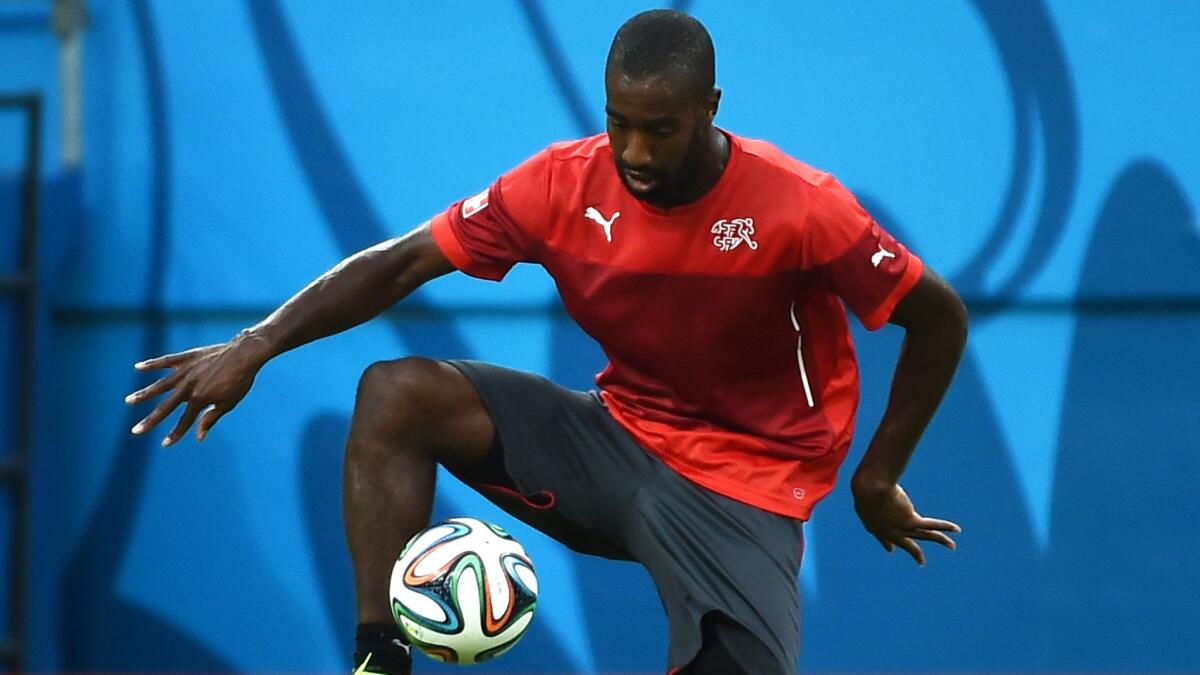 Switzerland defender Johan Djourou takes part in a team practice session Tuesday in Manaus, Brazil.