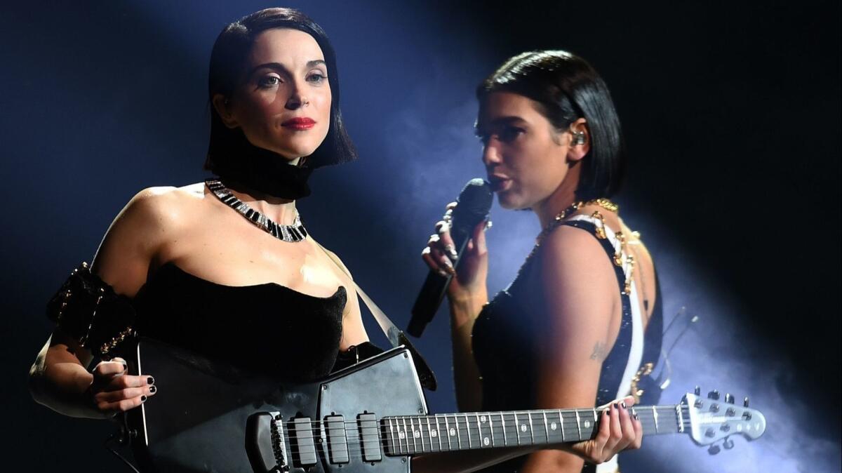 St. Vincent, left, and Dua Lipa perform onstage during the 61st Grammy Awards.