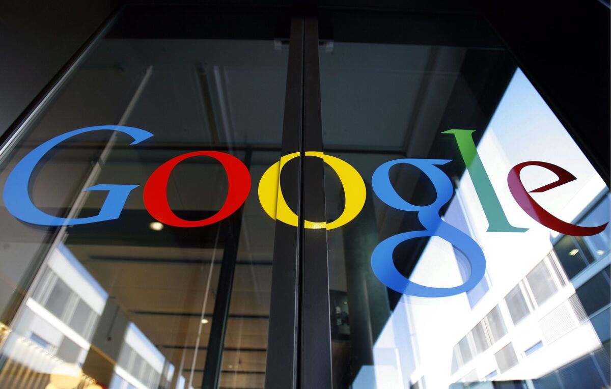 The Google logo is seen on the front door of the Google Engineering center in Zurich, Switzerland.