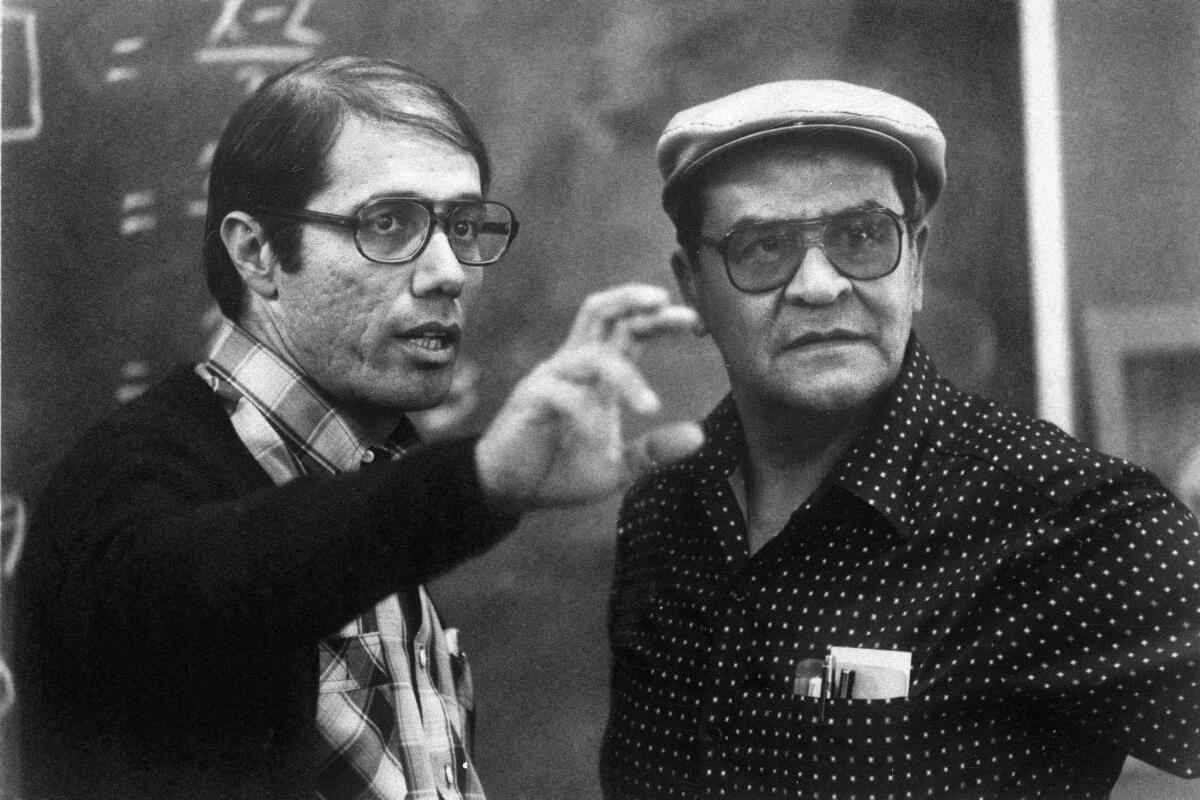 Actor Edward James Olmos, left, with real-life Garfield High School teacher Jaime Escalante during the filming in Los Angeles of "Stand And Deliver" in 1988. Olmos' portrayal of Escalante earned the actor an Oscar nomination.
