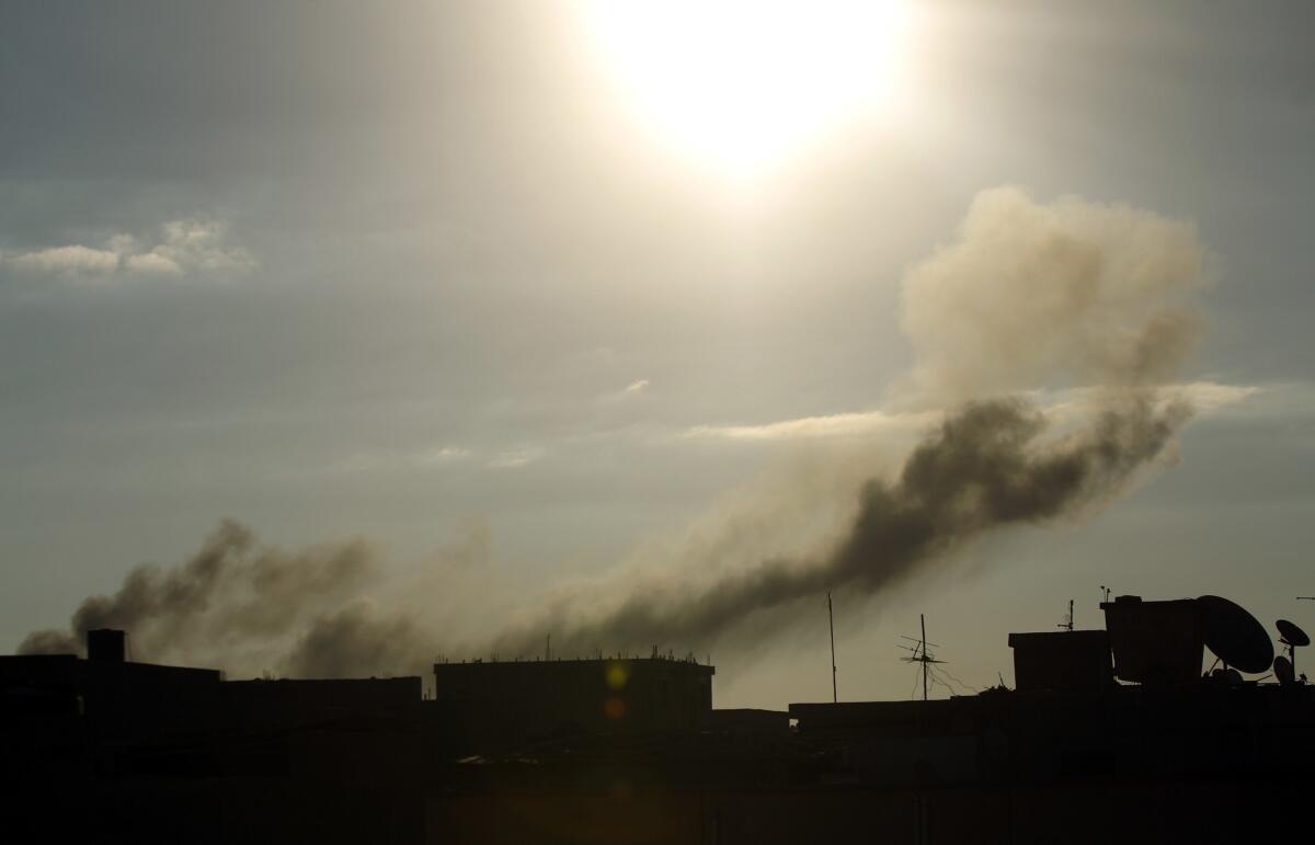 Smoke rises after an airstrike Aug. 27 near military camps in Benghazi, Libya. U.S. officials were caught off guard this week when United Arab Emirates warplanes carried out airstrikes against Islamist militias in Tripoli.