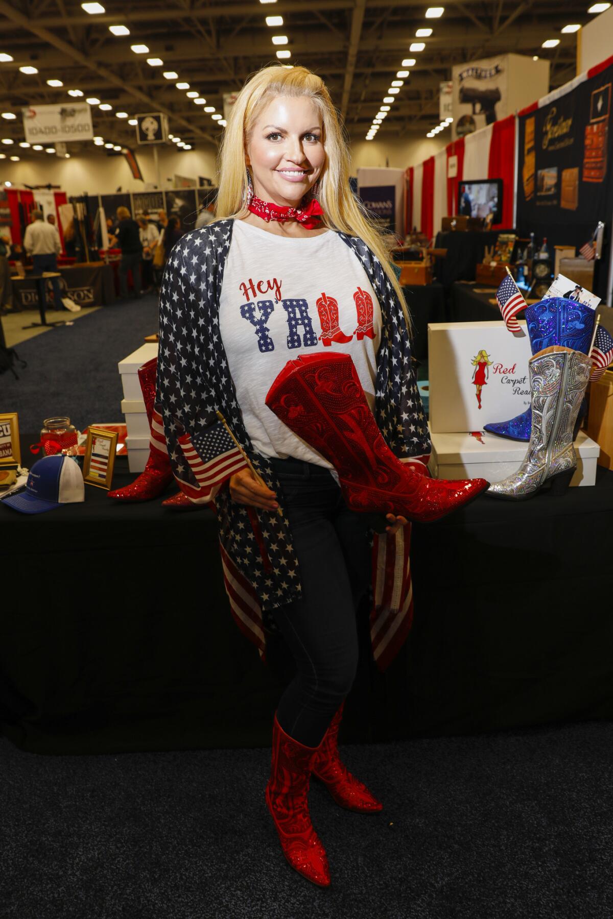 Brenda King, the "Boot Baroness" of Fort Worth, Texas, shows off her "Red Carpet Ready" boot, which sells for $195, at the 2018 NRA Annual Meetings & Exhibits in Dallas.