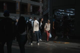 People shop in the central business district downtown.
