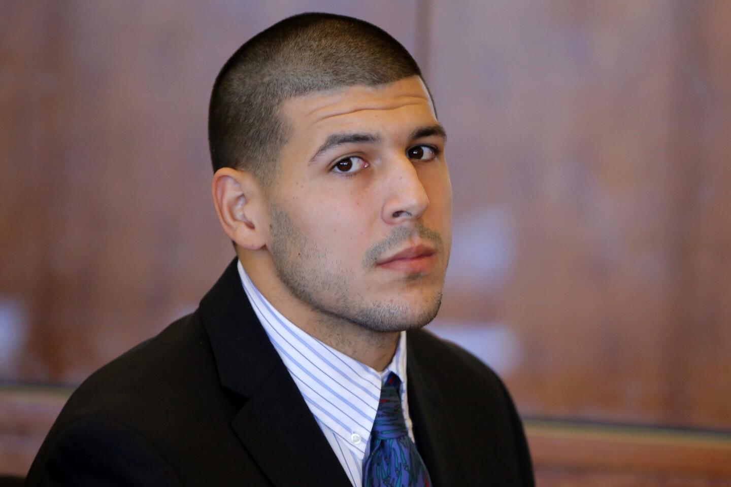 Aaron Hernandez, former player for the NFL's New England Patriots football team, attends a pre-trial hearing at the Bristol County Superior Court in Fall River, Massachusetts October 9, 2013, in connection with the death of semi-pro football player Odin Lloyd in June. Hernandez, who was a rising star in the NFL before his arrest and release by the Patriots, has pleaded not guilty.