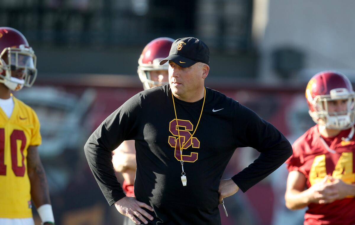 Clay Helton says he will win at USC the way his father taught him, through consistency and principle.