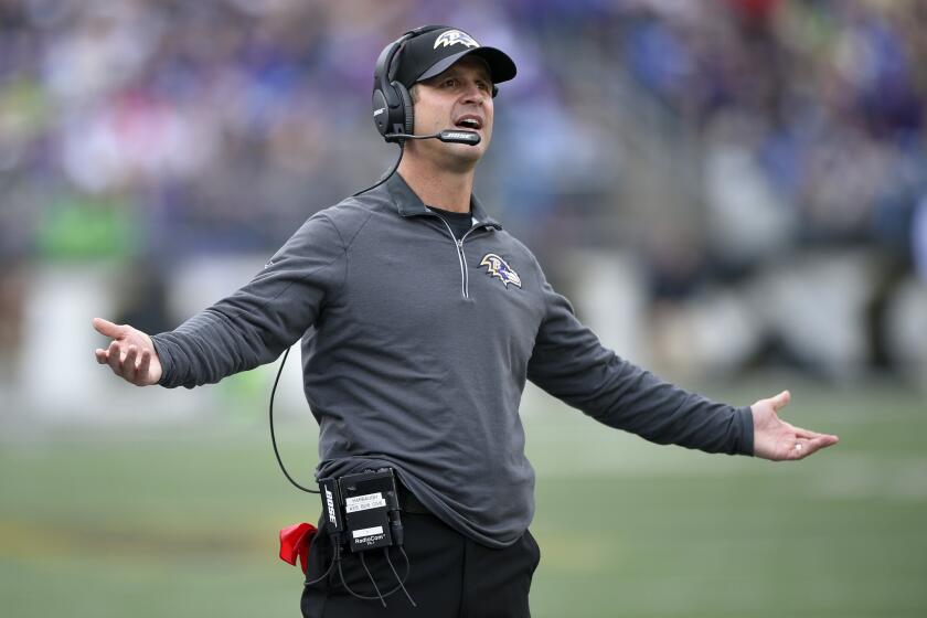 Baltimore Coach John Harbaugh reacts during the first half of a game against Seattle on Dec. 13.