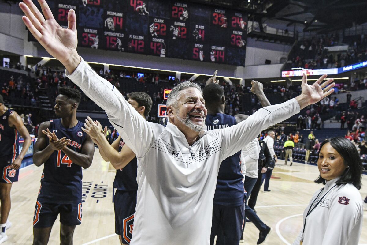 Auburn head coach Bruce Pearl celebrates a win over Mississippi after an NCAA college basketball game in Oxford, Miss., Saturday, Jan. 15, 2022. (AP Photo/Bruce Newman)
