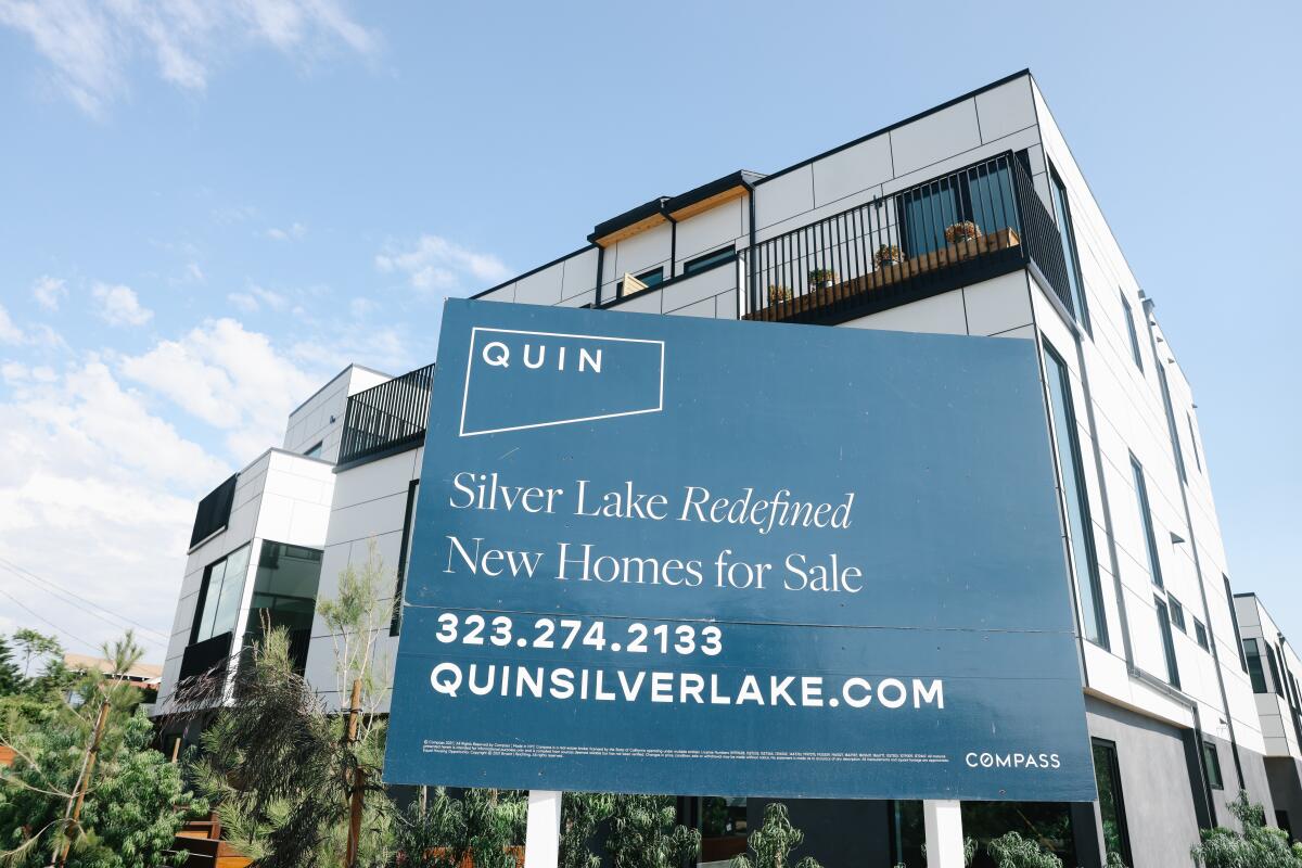 A sign advertises new homes for sale
