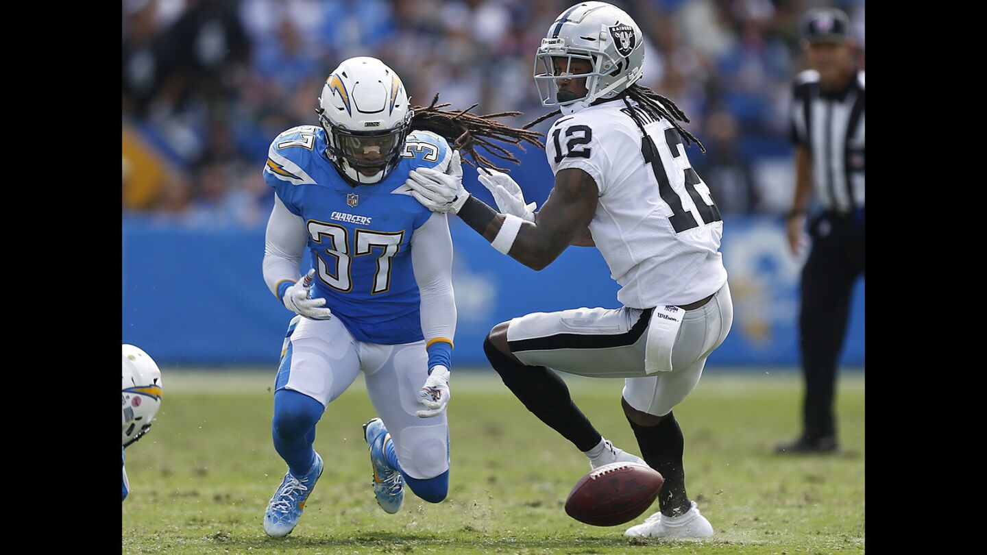 Los Angeles Chargers Jahleel Addae (37) recovers a fumble by Oakland Raiders Martavis Bryant in the 2nd quarter at the StubHub Center in Carson on Oct. 7, 2018. (Photo by K.C. Alfred/San Diego Union-Tribune)