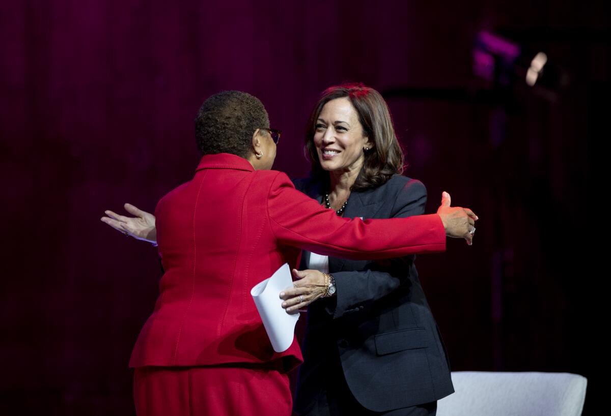 Vice President Kamala Harris, right, hugs mayoral candidate Karen Bass in October. Harris returns to L.A. on Monday.