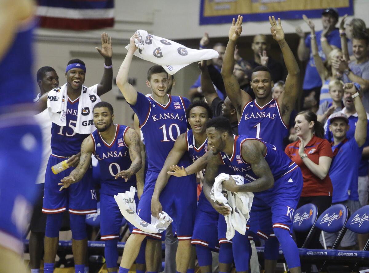 Kansas players celebrate in the final minutes of a game against Chaminade in the first round of the Maui Invitational.