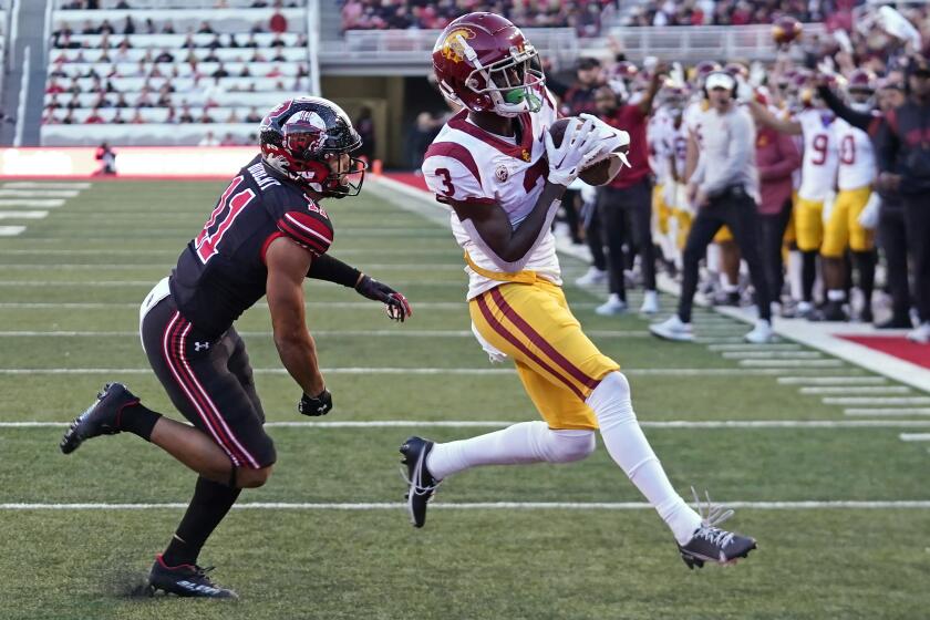 Southern California wide receiver Jordan Addison (3) scores a touchdown against Utah safety R.J. Hubert