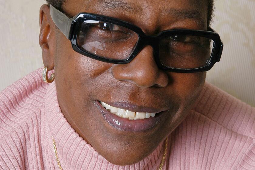 ** ADVANCE FOR Thursday, NOV. 13 **Afeni Shakur, 56-year-old mother of late rapper Tupac Shakur, poses at the Ritz Carlton Hotel in New York, Oct. 23, 2003. Shakur is CEO and founder of Amaru Entertainment/Amaru Records, which has put out several best-selling albums of her son's unreleased works since his 1996 slaying, and is executive producer of a new documentary on her son titled "Tupac: Resurrection." (AP Photo/Jim Cooper)
