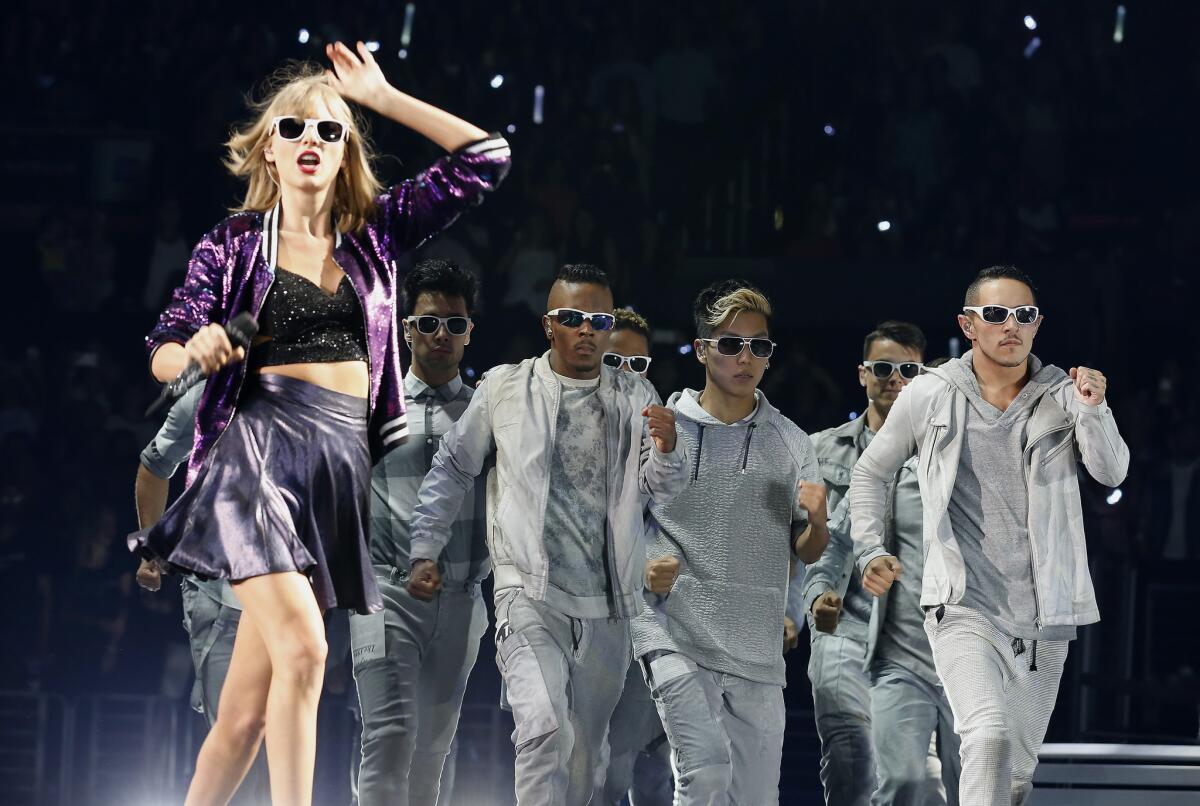 Taylor Swift performs at Staples Center in Los Angeles on Aug. 21, 2015. Like Iggy Azalea before her, Swift has earned six American Music Awards nominations.