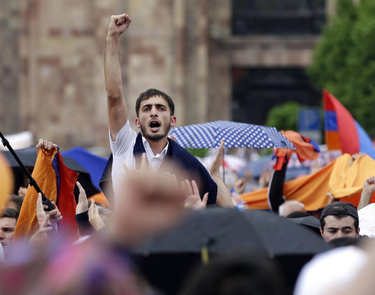 Tens of thousands of supporters of Nikol Pashinian celebrate on the central square of Armenia's capital.