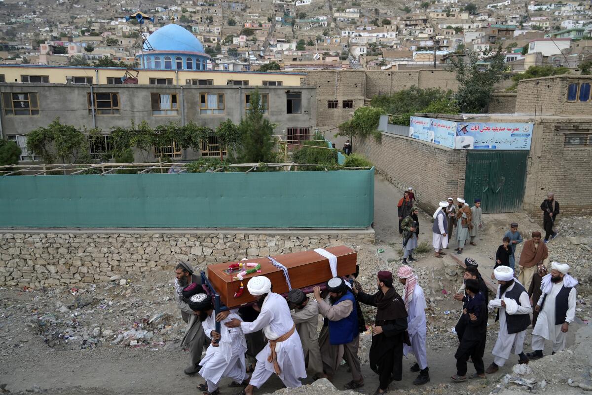 Mourners carrying a casket