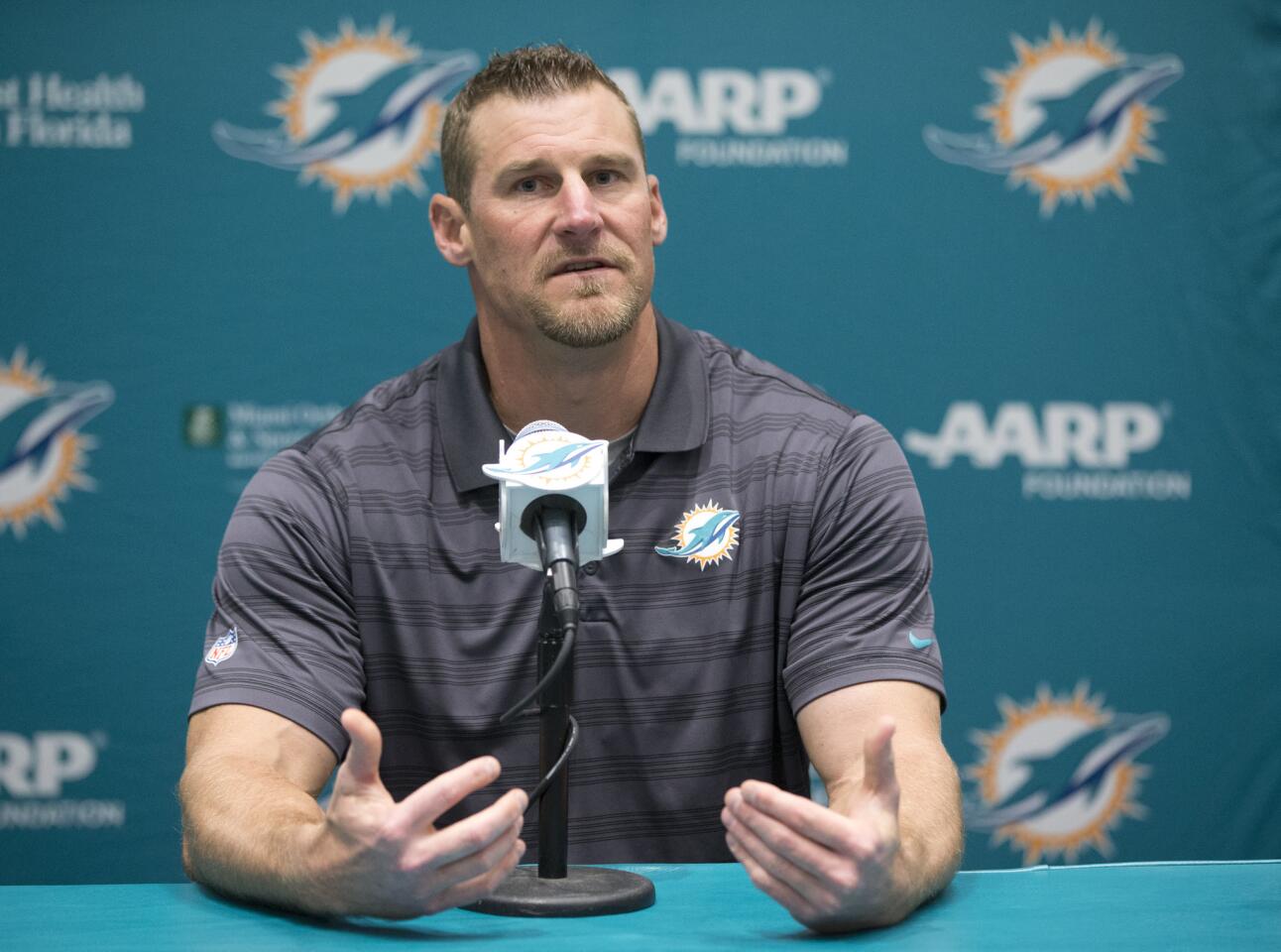 Former Miami Dolphins tight ends coach Dan Campbell speaks during a news conference after being promoted to interim head coach, Monday, Oct. 5, 2015 in Davie, Fla. Joe Philbin has been fired four games into his fourth season as coach of the Dolphins, and one day after a flop on an international stage that helped to seal his fate. (AP Photo/Wilfredo Lee)