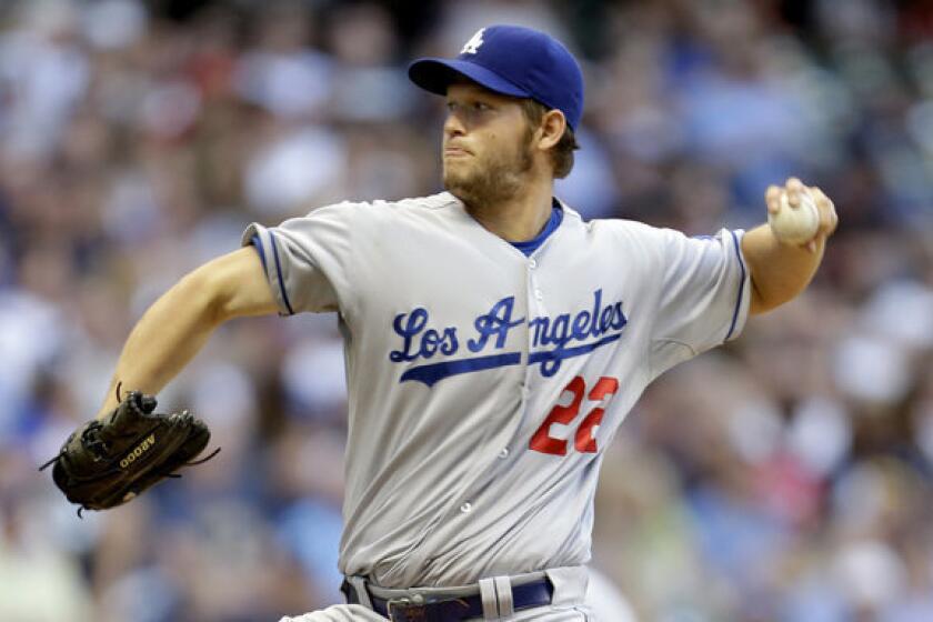 Dodgers' Clayton Kershaw pitches in the bottom of the first inning against the Milwaukee Brewers.