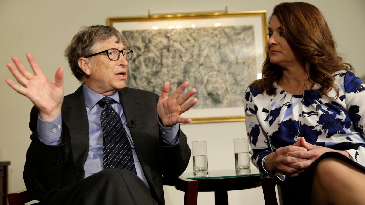 Bill and Melinda Gates talk to reporters about their foundation in New York on Feb. 22. The two are co-chairs of the largest private foundation in the world.