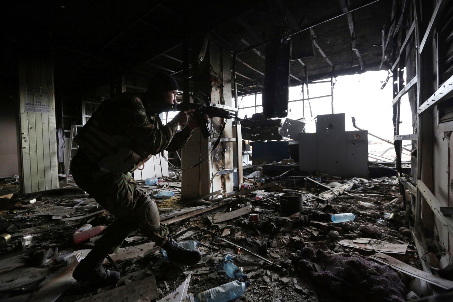 A Ukrainian soldier patrols inside the Donetsk airport. It has been the scene of fierce fighting between government troops and pro-Russia separatists since May.