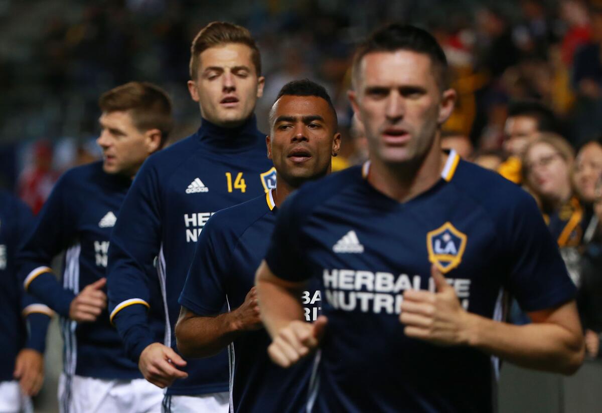 Galaxy players Steven Gerrard, Robbie Rogers, Ashley Cole and Robbie Keane (left to right) warm up before a game against D.C. United on March 6.