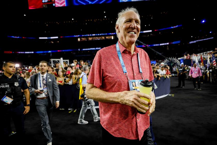 Houston, TX - April 3: Bill Walton watches before the start of Monday's national championship game against Connecticut in Houston. (K.C. Alfred / The San Diego Union-Tribune)