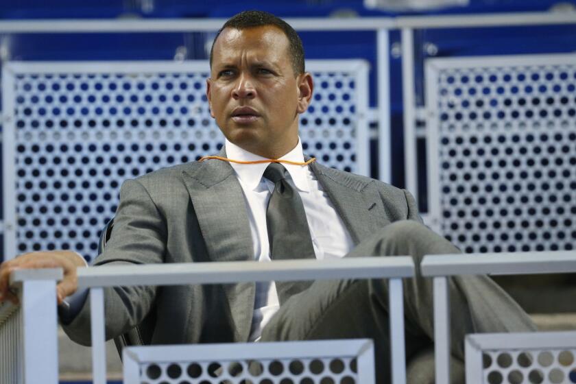 FILE - In this June 23, 2017, file photo, former baseball player Alex Rodriguez sits in the stands before the start of a baseball game in Miami. Rodriguez once again is taking over for Aaron Boone in a high-profile spot, this time moving into the ESPN booth for Sunday Night Baseball. ESPN announced Tuesday, Jan. 23, 2018, that A-Rod was joining its crew as an analyst. The former star slugger will become a rare, two-network announcer _ he will continue as a studio analyst for Fox Sports in the postseason. Rodriguez fills the ESPN spot held last season by Boone, hired last month to manage the New York Yankees. It will mark the second time Rodriguez has followed Boone. (AP Photo/Wilfredo Lee, File)