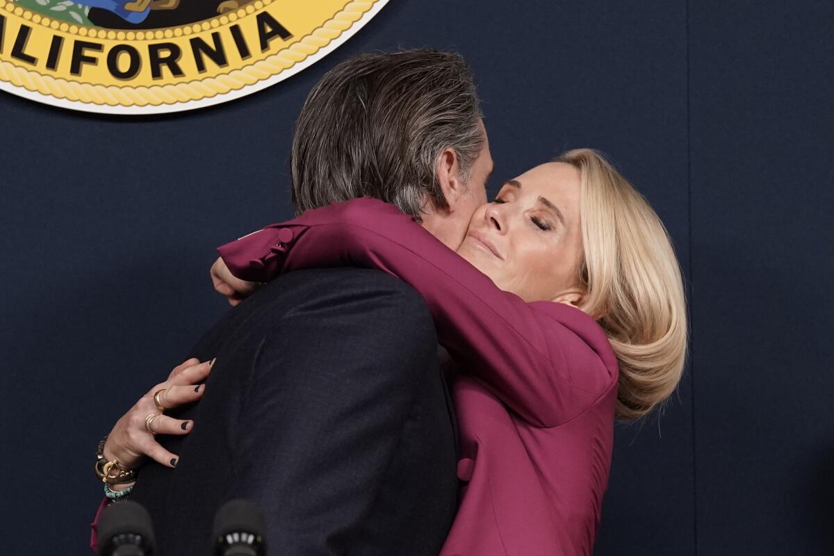 Gov. Newsom hugs his wife, Jennifer