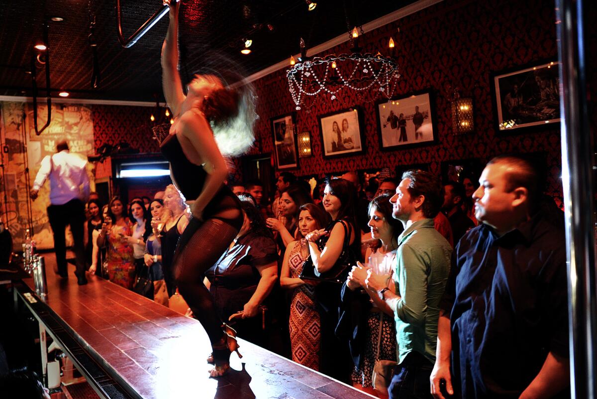 Customers enjoy a burlesque show on a Saturday night at the Eastside Luv bar in Boyle Heights.