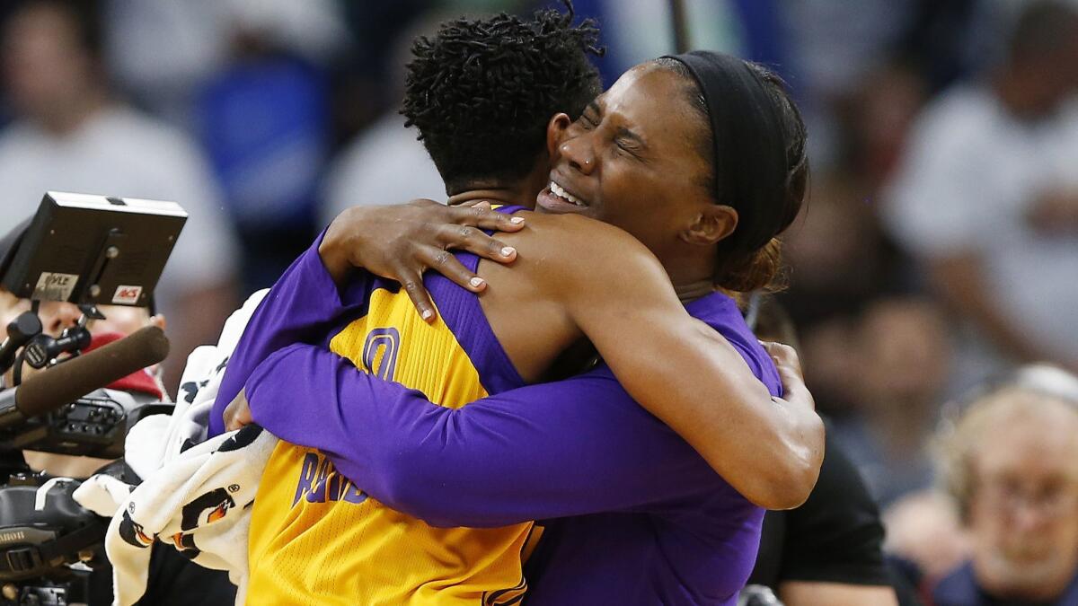 The Sparks' Alana Beard, left, is embraced by teammate Jantel Lavender after hitting the game-winning shot in Game 1 of last year's WNBA finals.