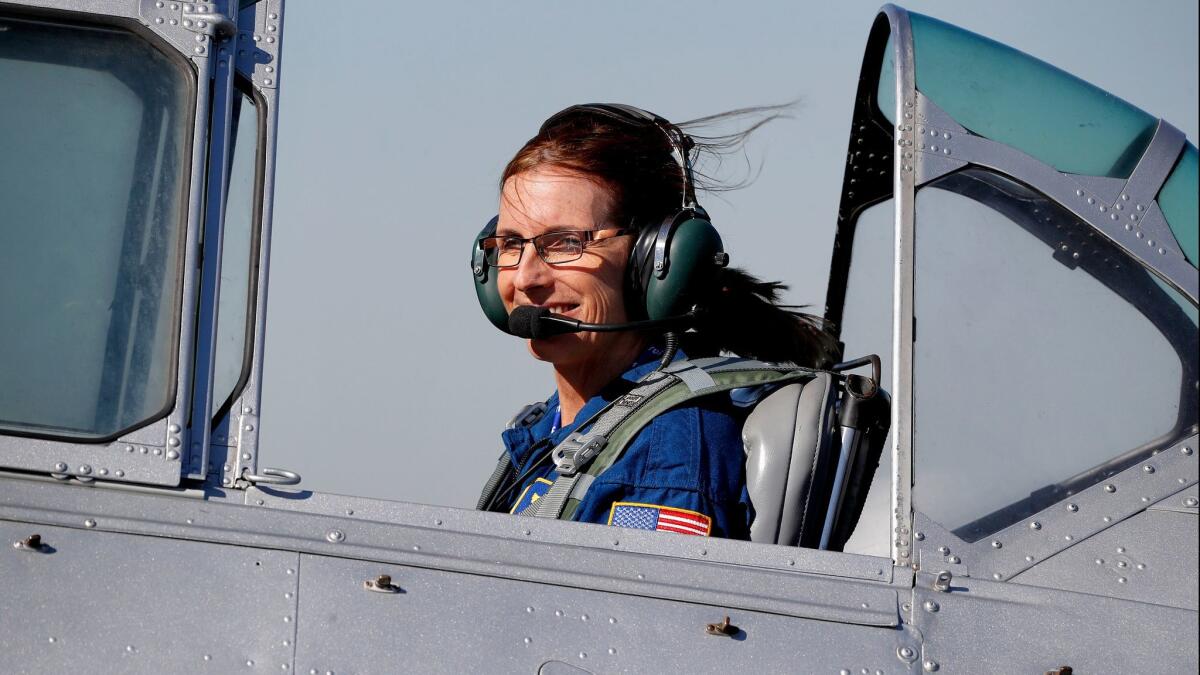 Martha McSally, a Tucson congresswoman running in Arizona's Republican primary for U.S. Senate, leaves a Phoenix campaign rally in a T-6 World War II plane on Jan. 12.