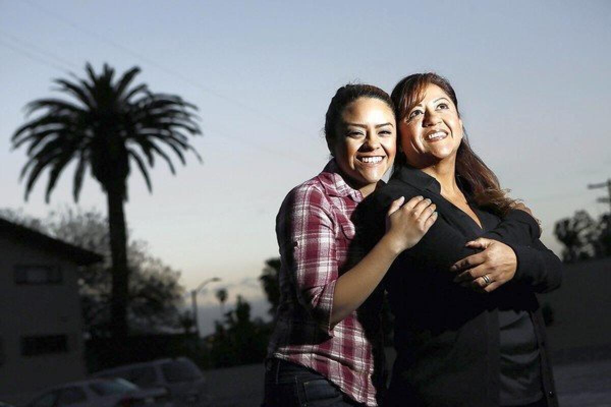 Saira Barajas, 21, left, with her mother, Maria Galvan, 43, at the Coalition for Humane Immigrant Rights of Los Angeles. Under a bipartisan immigration bill, Galvan could realize her dream of opening a hair salon.